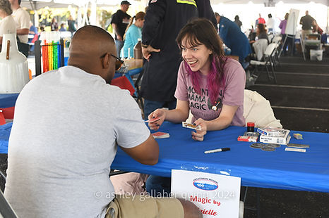 Brielle doing magic at a communit event