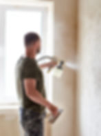 Man painting wall