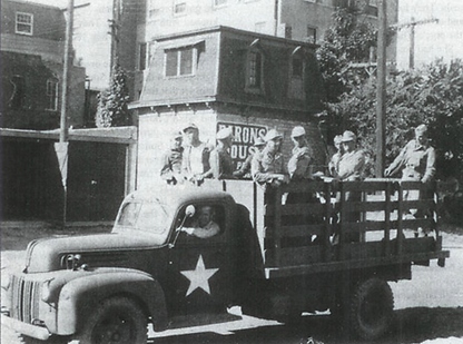 Army truck with a German POW work detail and their guards, passing through Concordia KS - photo Courtesy of Cloud County KS Tourism, Camp Concordia POW Museum, and Kansas Travel.