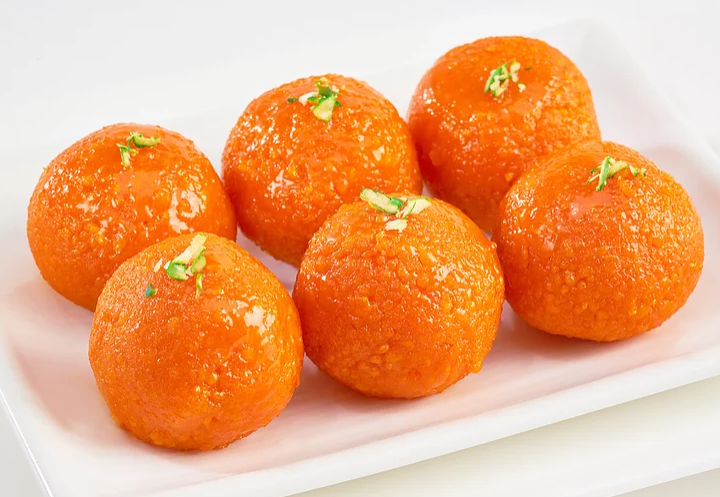 Eye-level view of Indian sweets displayed in a shop
