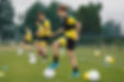 Teenage Boys Training Sports in a Row. Soccer Summer Camp for Young Boys. Happy Football P