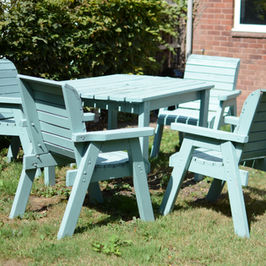 Enclosed garden with patio furniture.