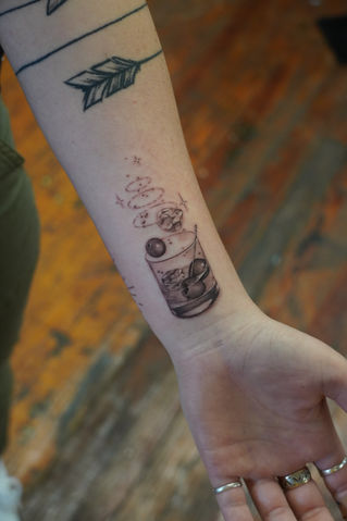 fine line single needle tattoo of a mixed cocktail