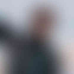 Gilson Instructor of the Island Kite School is smiling bride after a kite session at the Ponta Preta Beach