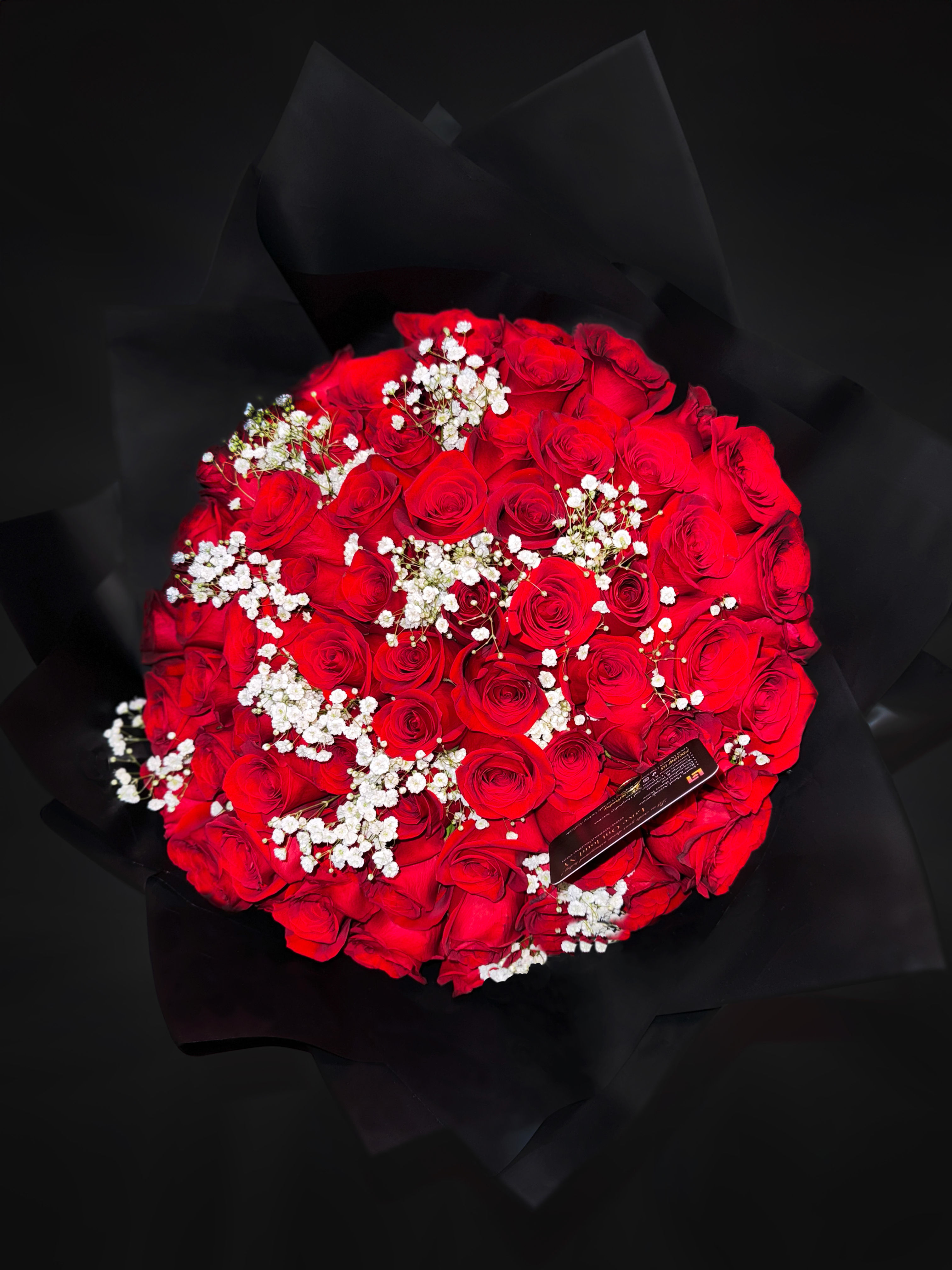72 red roses mixed with babies breath