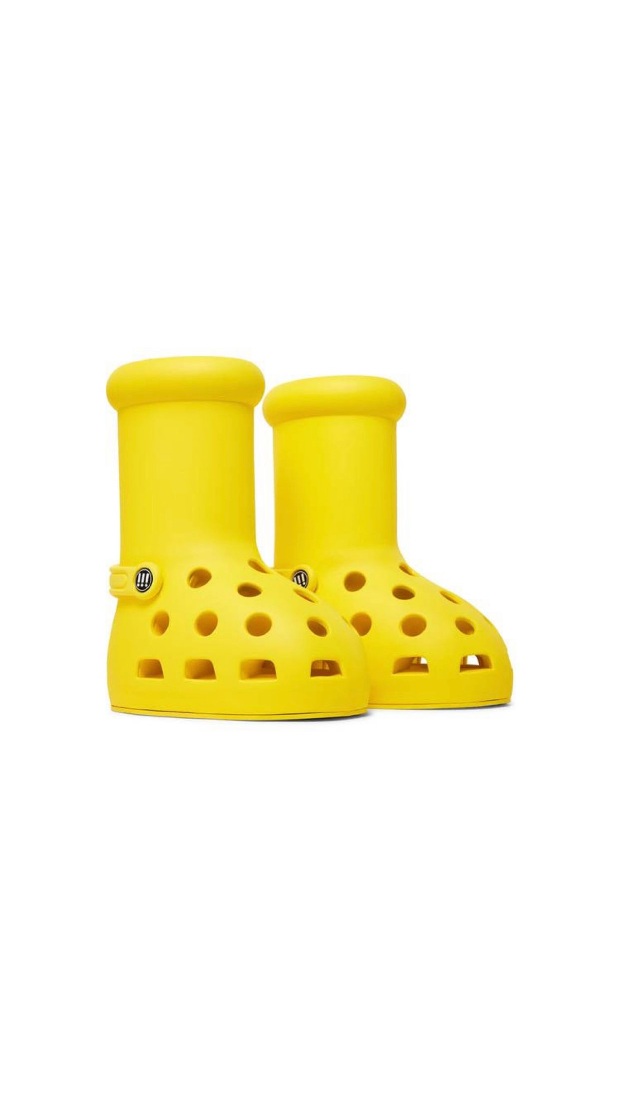 Two bright yellow boots with holes resembling Crocs, white background.
