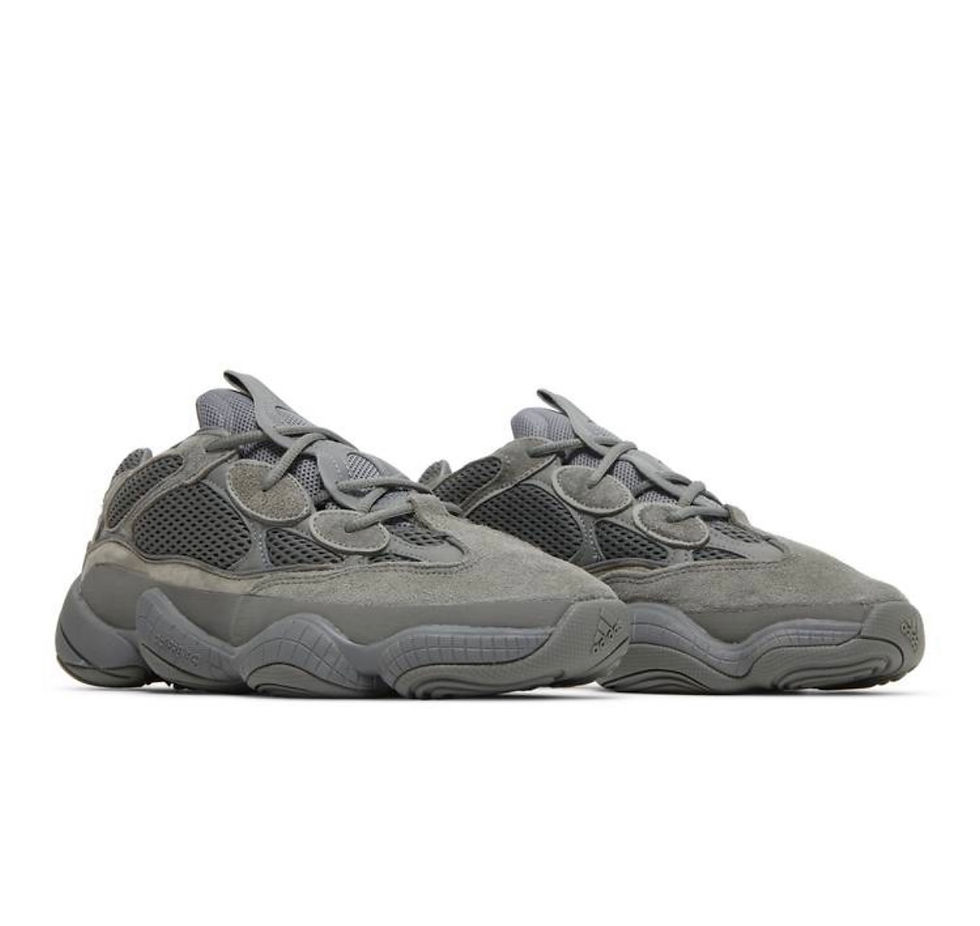 Pair of grey YEEZY 500 sneakers with mesh and suede details.