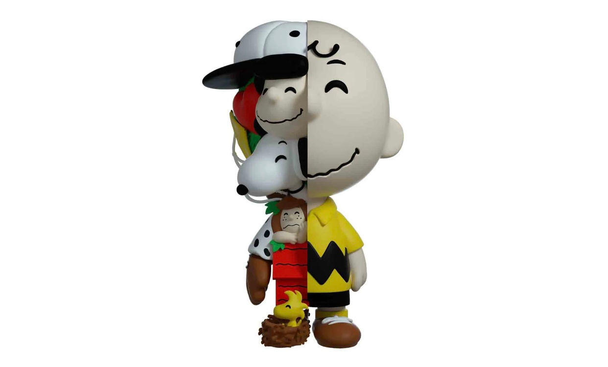 Dissected Charlie Brown vinyl art toy revealing Snoopy and Woodstock figures inside.