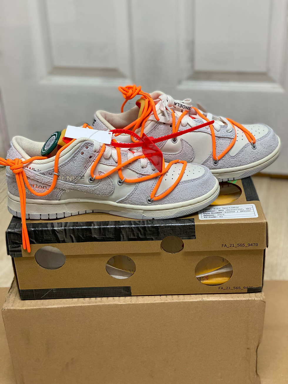 Off-White Nike Dunks, cream/gray, orange laces, on box "FA_21_045_0478".