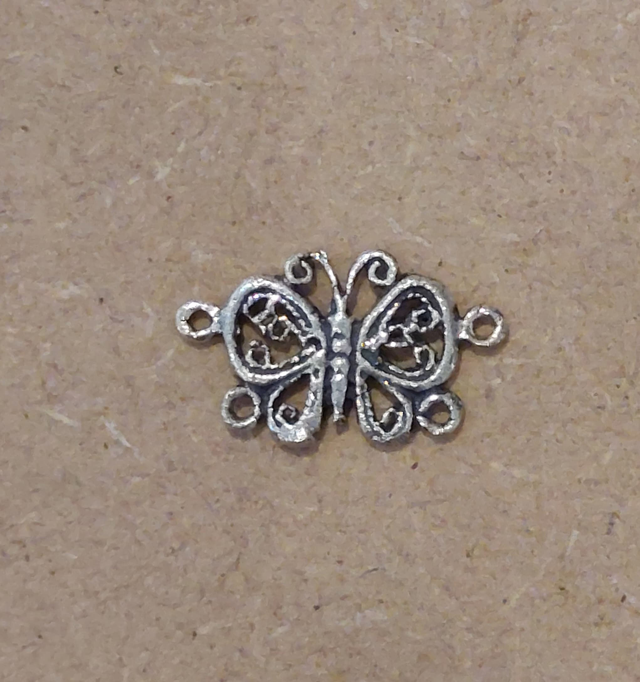 Ornate butterfly charm