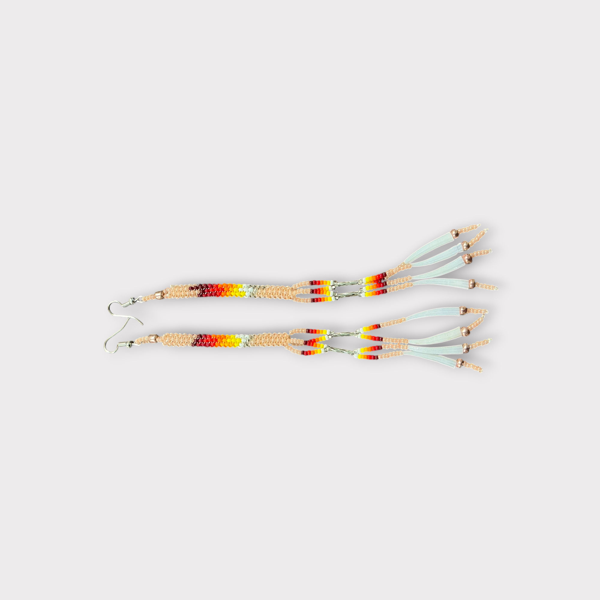 Long beaded peach color earrings 