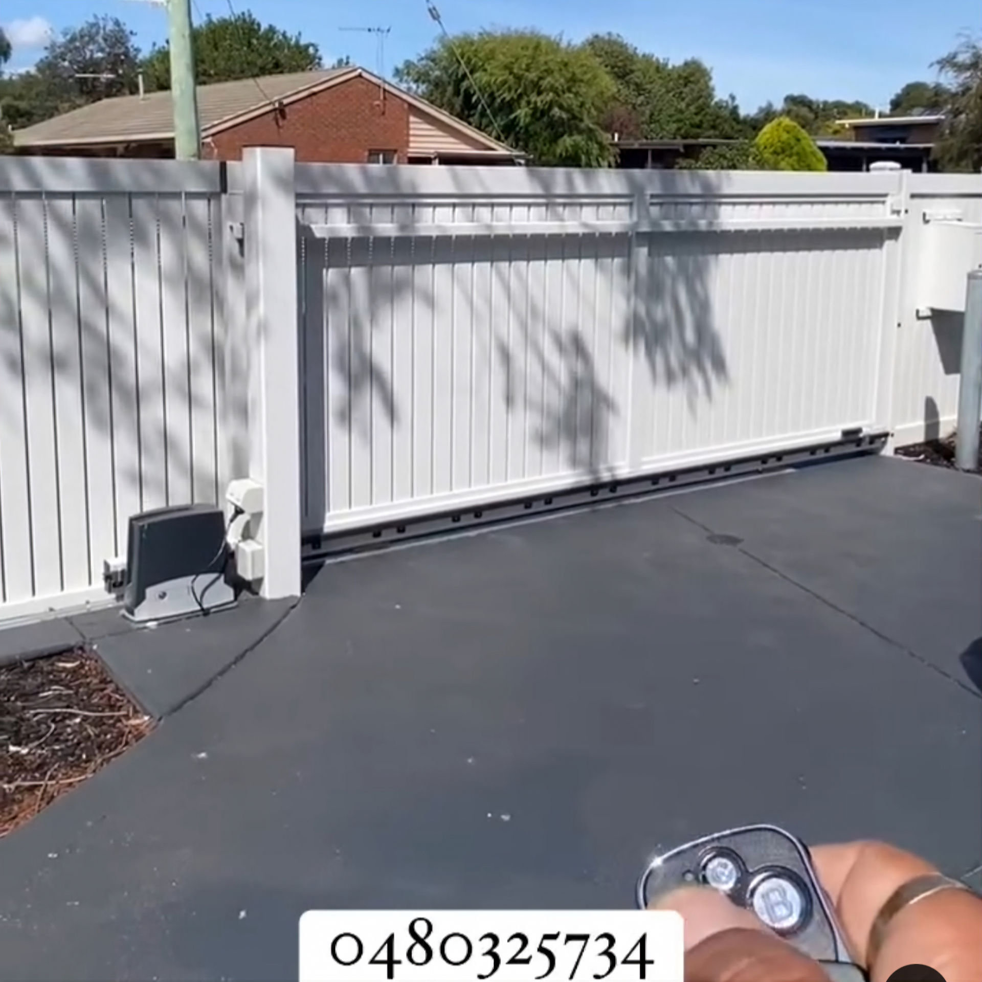Sliding gate motor installed for a residential driveway gate