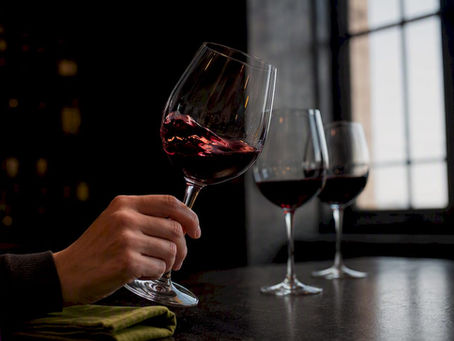 Beginner swirling wine during tasting