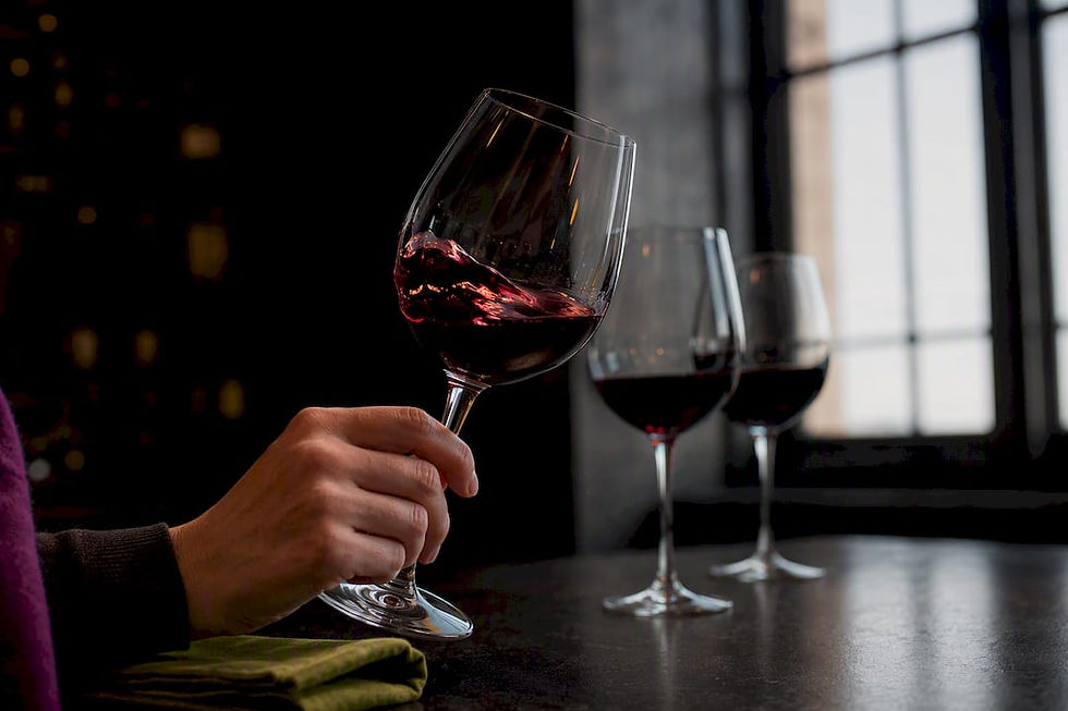 Beginner swirling wine during tasting