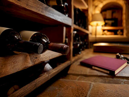 Home wine cellar corner with wooden racks and bottles