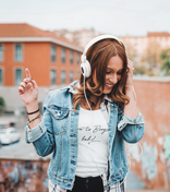 Woman wearing white Born to Boogie baby t-shirt