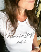 Woman wearing white Born to Boogie baby t-shirt