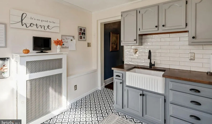 Renovated kitchen with gray cabinets, farmhouse sink, custom built-ins Fishtown Philadelphia
