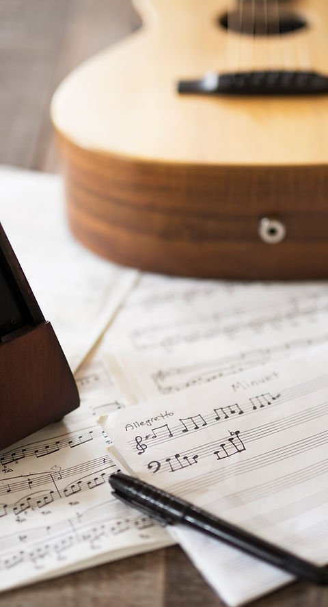 Sheet Music and Guitar
