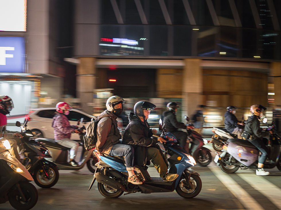 Long exposure photograph of scooters in Taipei, Taiwan