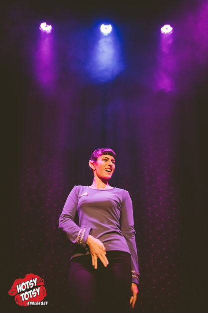A photo of Luna performing as Spock from Star Trek, making a lewd gesture and laughing.