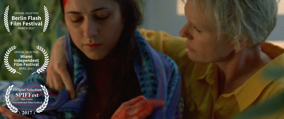 Banner image of Sangre's laurels with Louise Tozer consoling a bloodied Emma Zadow on a couch.