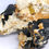 Thumbnail: Shiny Schorl on Silver Topaz and Feldspar