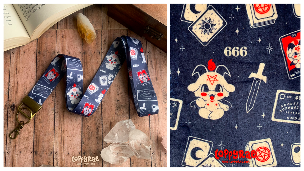 Navy lanyard with occult symbols, cute cartoon Baphomet illustration, and tarot elements. Background features wooden table, crystals and an open book. The image on the right is the same pattern printed on fleece.