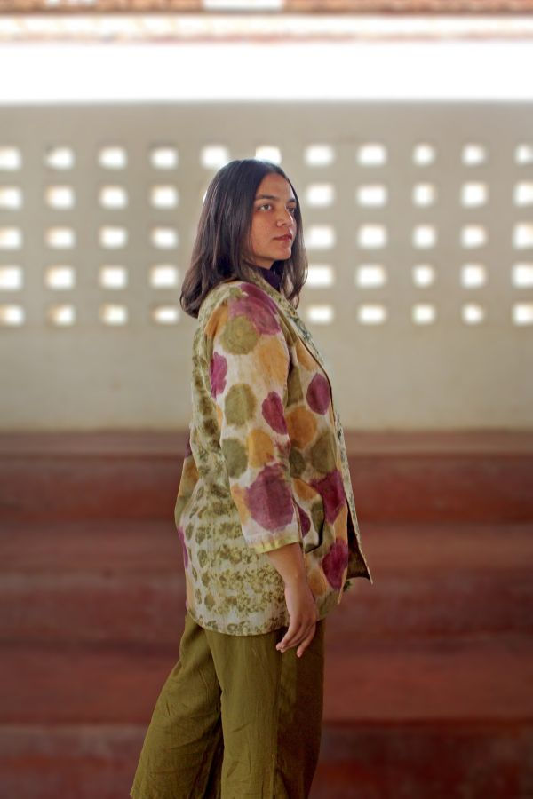 Thumbnail: right side of model wearing Bageeya "Mayuri" Handwoven Tant Cotton and Organic cotton reversible jacket