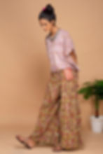 Model side image of Bageeya “Pink mimosa” Khadi Organic Cotton Crop Top, Crafted with Sacred Temple Marigolds and Walnut"
