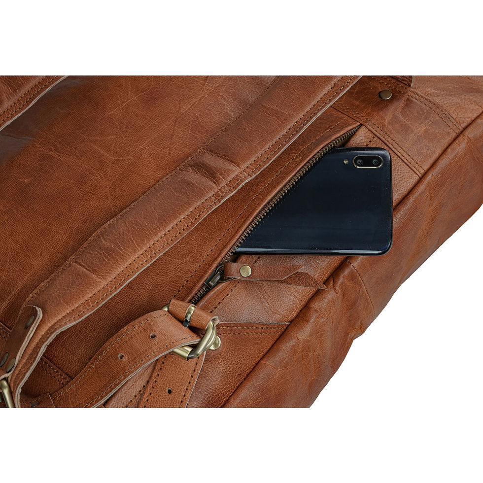 Thumbnail: Detailed view of YKK zippers and strong brass fittings on the vegetable tanned leather bag