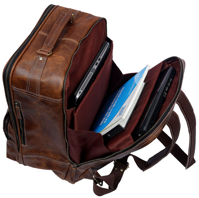 Business professional with leather backpack using laptop