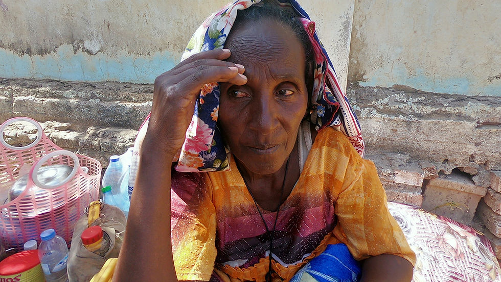 An Ethiopian woman who fled the ongoing fighting in Tigray region arrives in Hamdayet, a Sudanese border town. (El Tayeb Siddig/REUTERS)
