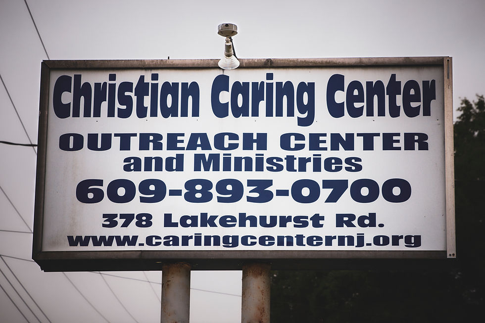 Eye-level view of a welcoming church entrance with open doors and warm lighting