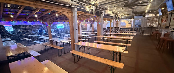 Large group reservation setup at outdoor sports bar patio on Barracks Row