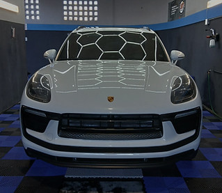 Dark Background White Porsche Shinning front view.jpg