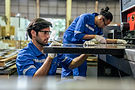 attractive-two-male-industrial-worker-working-in-m-2026-01-09-08-11-29-utc.jpg