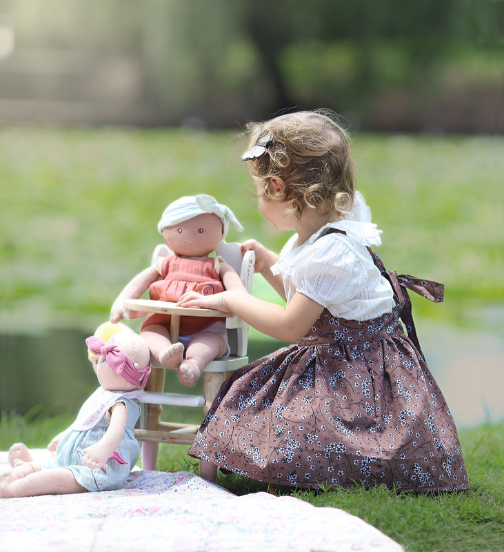 Thumbnail: Little girl playing with Baby Aria personalise doll