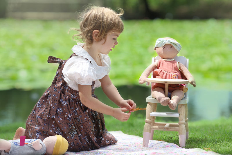 Thumbnail: Little girl playing with Baby Aria personalise doll