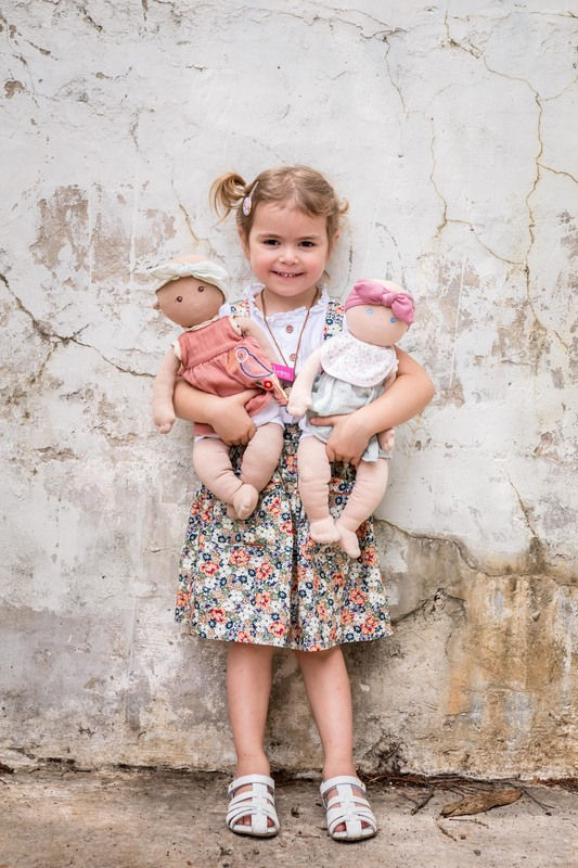 Thumbnail: Little girl playing with Baby Aria personalise doll