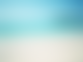 Wide angle view of pristine white sandy beach with turquoise waters