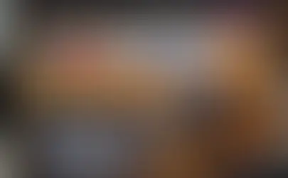 Independent loan monitor reviewing construction site progress and financial draw request documents for a property development project