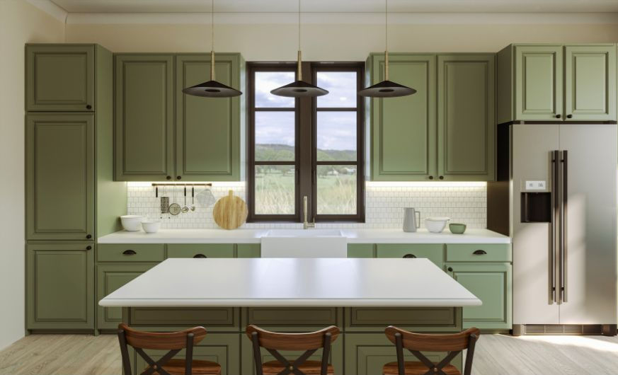 Modern kitchen with green cabinets, white countertops, and wooden chairs. Large window with a scenic view. Pendant lights add elegance.