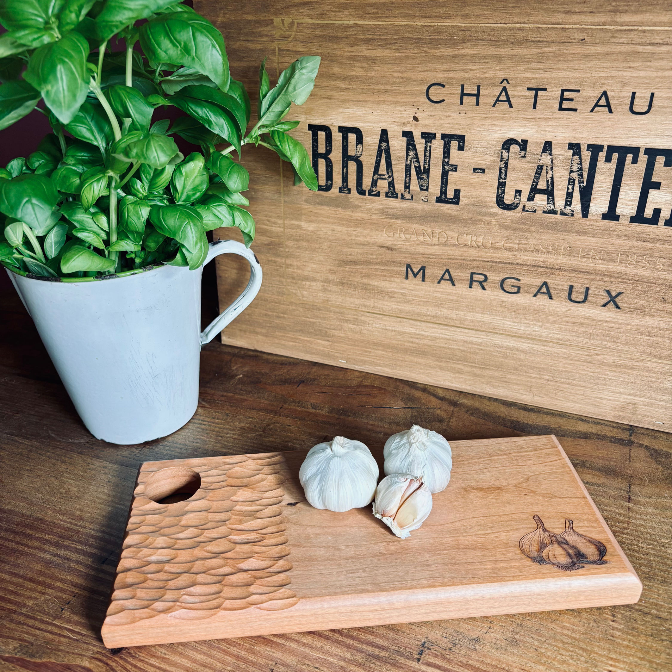 Carved cherry handle garlic board