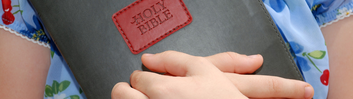 Girl Holding BIble