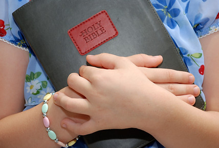 Girl Holding BIble