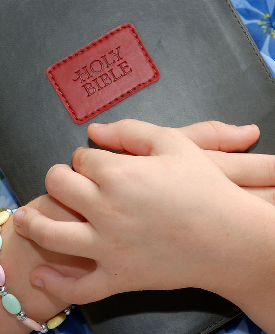 Girl Holding BIble