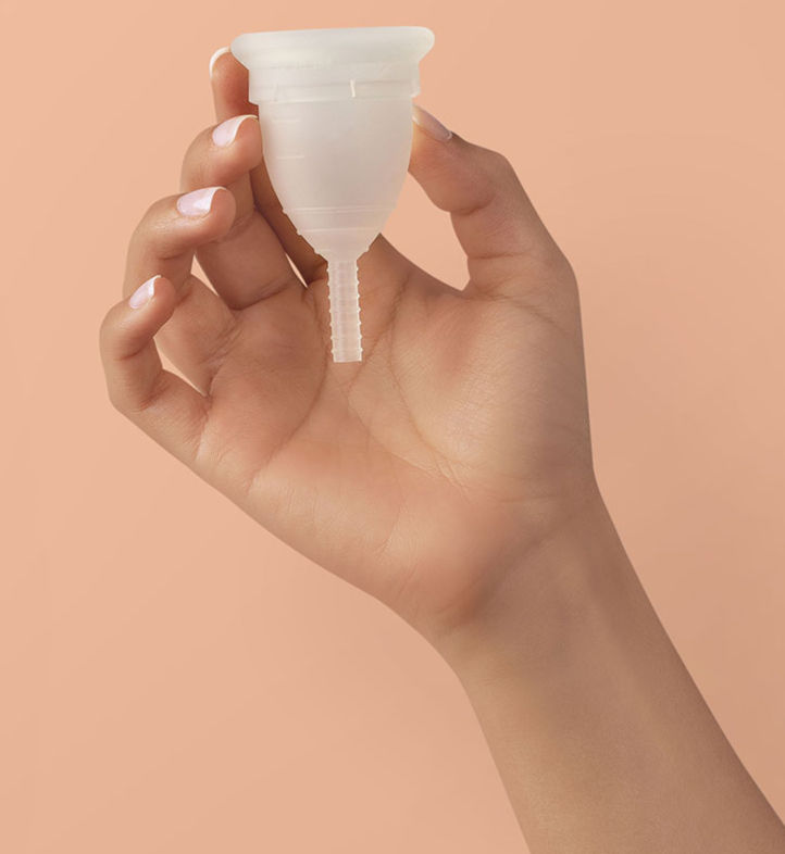 hand holding menstrual cup