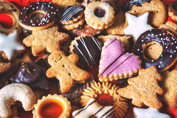 Assortment of decorated holiday cookies sitting on a table