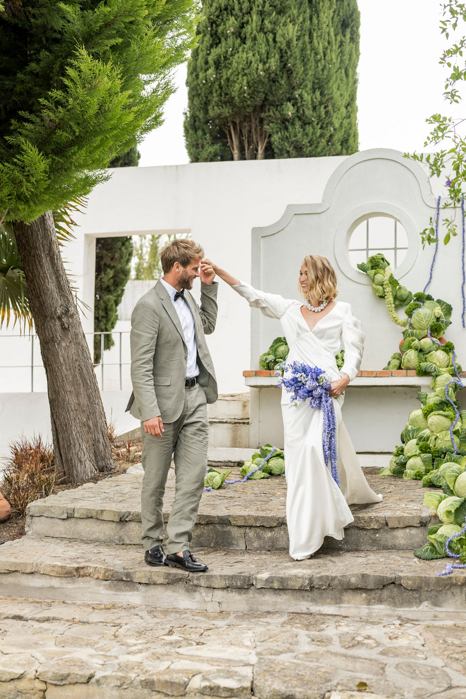 Destination wedding in Ericeira, Portugal, at Casa Socato. Wedding Party at the pool. Table setting with vegetables